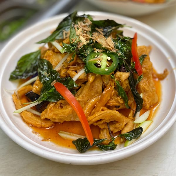 Thai Basil's crispy fish with chili sauce, basil, red and green peppers, and fried shallots.